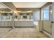 Bathroom showcasing dual sinks, a large mirror, and a separate shower and tub at 1697 E Linda Ln, Gilbert, AZ 85234