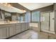 Bathroom featuring a double sink vanity, a separate shower, and a soaking tub at 1697 E Linda Ln, Gilbert, AZ 85234
