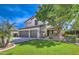 Well-manicured lawn and mature trees add curb appeal to this home at 1697 E Linda Ln, Gilbert, AZ 85234