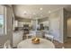 Bright kitchen with white cabinets, stainless steel appliances, and a central island at 1697 E Linda Ln, Gilbert, AZ 85234
