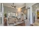 Inviting living area with staircase and ample natural light from large windows at 1697 E Linda Ln, Gilbert, AZ 85234