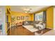 Bright living room with comfortable sectional sofa and hardwood floors at 1697 E Linda Ln, Gilbert, AZ 85234