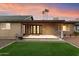 Large backyard with covered patio, well-maintained landscaping, offering a tranquil outdoor living space at 1801 E Berridge Ln, Phoenix, AZ 85016