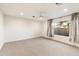 Bright bedroom with natural light, plush carpeting, and ceiling fan at 1801 E Berridge Ln, Phoenix, AZ 85016