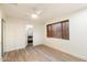 Bright bedroom with wood floors, natural light and easy access to the bathroom at 1801 E Berridge Ln, Phoenix, AZ 85016