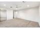 Bright bedroom features neutral carpeting, a ceiling fan, and a mirrored closet at 1801 E Berridge Ln, Phoenix, AZ 85016
