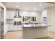 Modern kitchen featuring stainless steel appliances, a subway tile backsplash, and a center island at 1801 E Berridge Ln, Phoenix, AZ 85016