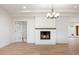 Open-concept living area with fireplace and wood floors. Perfect for entertaining and relaxation at 1801 E Berridge Ln, Phoenix, AZ 85016