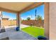 Charming backyard with patio and artificial grass at 19847 W Monroe St, Buckeye, AZ 85326