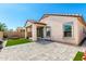 Backyard with covered patio, artificial grass and desert landscaping at 19847 W Monroe St, Buckeye, AZ 85326