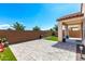 Beautiful backyard with patio, artificial grass, and privacy wall at 19847 W Monroe St, Buckeye, AZ 85326