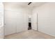 Bright bedroom featuring a double door closet and an ensuite bathroom at 19847 W Monroe St, Buckeye, AZ 85326