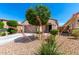Charming single-story home with low-maintenance desert landscaping and a two-car garage at 19847 W Monroe St, Buckeye, AZ 85326