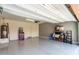 Spacious garage featuring epoxy floor, storage and water heater at 19847 W Monroe St, Buckeye, AZ 85326