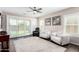 Cozy living room featuring a ceiling fan, comfortable seating, and sliding glass doors at 19847 W Monroe St, Buckeye, AZ 85326