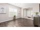 Living room with hardwood floors, plantation shutters, and neutral paint at 19847 W Monroe St, Buckeye, AZ 85326