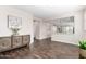 Open living space featuring dark floors and seamless flow to the kitchen at 19847 W Monroe St, Buckeye, AZ 85326