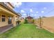 An inviting backyard featuring green grass, a gazebo, and a covered patio area at 2046 E Paradise Ln, Phoenix, AZ 85022