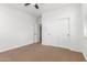 View of a bedroom with carpeted floor, white walls, and a closet with sliding doors at 2046 E Paradise Ln, Phoenix, AZ 85022