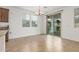 Dining area with tile floors, chandelier, and sliding glass doors to the backyard at 2046 E Paradise Ln, Phoenix, AZ 85022