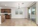 Bright dining area with a chandelier and sliding glass doors to the outdoor patio at 2046 E Paradise Ln, Phoenix, AZ 85022