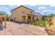 Back exterior of home with lattice fence, patio, and drought-resistant yard at 2046 E Paradise Ln, Phoenix, AZ 85022