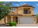 Inviting two-story home with a charming front porch and a two-car garage at 2046 E Paradise Ln, Phoenix, AZ 85022