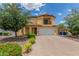 Home front exterior showing paved driveway, desert landscaping, and two car garage at 2046 E Paradise Ln, Phoenix, AZ 85022