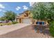View of the house exterior with a green tree and beautiful front yard landscaping at 2046 E Paradise Ln, Phoenix, AZ 85022