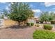 Well-maintained front yard with mature landscaping and a view of the two-story home at 2046 E Paradise Ln, Phoenix, AZ 85022