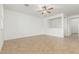 Bright living room featuring neutral walls, a ceiling fan, and tile flooring at 2046 E Paradise Ln, Phoenix, AZ 85022