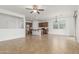 Open-concept living space with tile floors connecting to the kitchen, filled with natural light at 2046 E Paradise Ln, Phoenix, AZ 85022