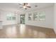 Living room with tile floors leading to sliding glass doors and multiple windows at 2046 E Paradise Ln, Phoenix, AZ 85022