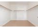 Spacious walk-in closet with ample shelving and rod space for storage at 2046 E Paradise Ln, Phoenix, AZ 85022