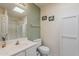 Clean bathroom featuring a white vanity, toilet, and shower with glass doors at 205 N 74Th St # 227, Mesa, AZ 85207