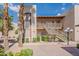 Exterior of condo featuring stairways, multiple units, and desert landscaping at 205 N 74Th St # 227, Mesa, AZ 85207