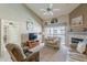 Cozy living room featuring a fireplace and sliding doors opening to a private balcony at 205 N 74Th St # 227, Mesa, AZ 85207