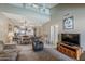 Open-concept living room with neutral tones and a view into the eat-in kitchen at 205 N 74Th St # 227, Mesa, AZ 85207