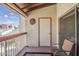Outdoor patio with a chair, exterior wall decor, and a view of the community at 205 N 74Th St # 227, Mesa, AZ 85207