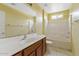 Well-lit bathroom features a vanity, a mirror, and a shower-tub combination for convenience at 2286 E Mohave Ln, Apache Junction, AZ 85119