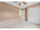 Inviting bedroom features a spacious closet and a ceiling fan for enhanced comfort and functionality at 2286 E Mohave Ln, Apache Junction, AZ 85119