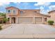 Charming home featuring a three-car garage and arched windows at 2286 E Mohave Ln, Apache Junction, AZ 85119