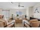 Open living area with stylish decor, ceiling fan, and hardwood floors at 2286 E Mohave Ln, Apache Junction, AZ 85119