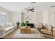Bright living room with a ceiling fan, hardwood floors, and comfortable seating at 2286 E Mohave Ln, Apache Junction, AZ 85119