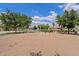 Community playground featuring swings, mature trees, and a grassy area for outdoor fun at 2286 E Mohave Ln, Apache Junction, AZ 85119
