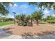 Community playground featuring slide and climbing structure surrounded by green space at 2286 E Mohave Ln, Apache Junction, AZ 85119