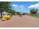 Community playground area with play equipment for and nearby homes, promoting outdoor fun at 2286 E Mohave Ln, Apache Junction, AZ 85119