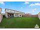Virtually staged backyard with lush green grass and ample space for outdoor living at 23010 E Pummelos Rd, Queen Creek, AZ 85142