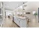 Bright and spacious open-concept area with a modern kitchen and a comfortable living space at 23010 E Pummelos Rd, Queen Creek, AZ 85142