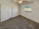 Cozy bedroom with carpet, neutral walls, and a bright window with great natural light at 24811 W Wayland Dr, Buckeye, AZ 85326